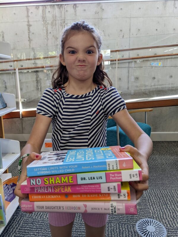 Lara with Parent School books