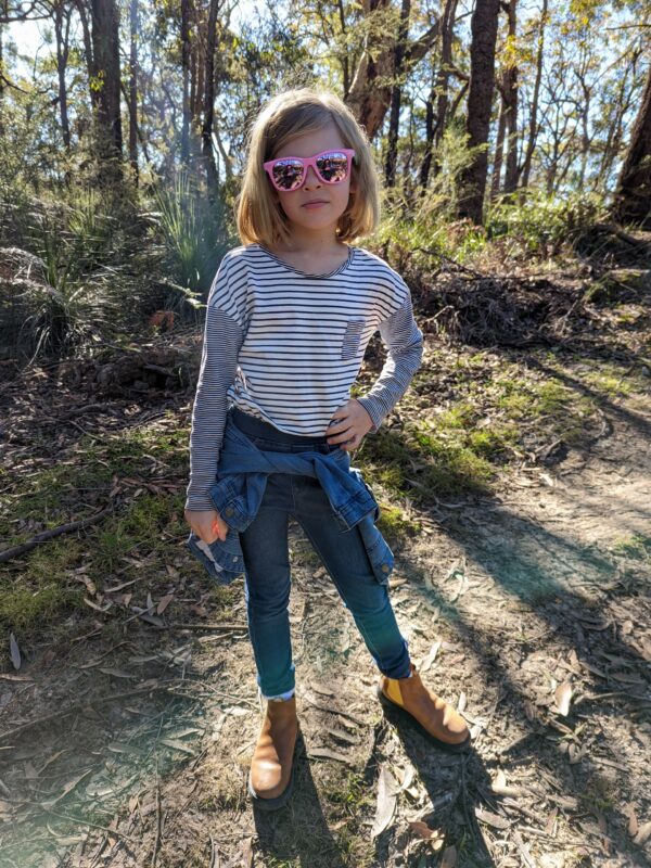 Olivia bush walking with unbreakable Flexi sunglasses on.