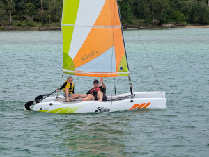 Young girl and Dad sailing a Hobie cat in Vanuatua