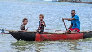 Village family fishing for dinner